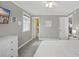 Bedroom with a glimpse into the bathroom, with neutral tones and a serene ambiance at 308 36Th Ave. N, North Myrtle Beach, SC 29582