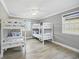 Comfortable bedroom featuring two sets of bunk beds and wood-look floors at 308 36Th Ave. N, North Myrtle Beach, SC 29582