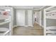 Neutral bedroom with closet, passage door, and wood-look floors at 308 36Th Ave. N, North Myrtle Beach, SC 29582