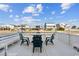 Outdoor deck space with table and chairs overlooking the canal at 308 36Th Ave. N, North Myrtle Beach, SC 29582