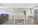 Bright dining room with seating for six, complemented by white wainscoting and stylish gray walls at 308 36Th Ave. N, North Myrtle Beach, SC 29582