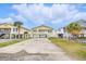 Charming raised beach house with a spacious driveway and manicured landscaping at 308 36Th Ave. N, North Myrtle Beach, SC 29582