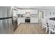 Modern kitchen featuring white cabinets, stainless steel appliances, and granite countertops at 308 36Th Ave. N, North Myrtle Beach, SC 29582