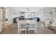Open-concept living room features a flat-screen TV, fireplace, and sliding glass doors to the outdoor patio at 308 36Th Ave. N, North Myrtle Beach, SC 29582