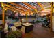 Cozy outdoor seating area on wooden deck with fire pit and string lights at 3255 Gervais Ln., Myrtle Beach, SC 29588