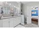 Bright bathroom with double vanity, gray quartz counters, and tile floors at 3255 Gervais Ln., Myrtle Beach, SC 29588
