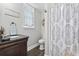 Charming bathroom featuring a decorative shower curtain and sleek vanity at 3255 Gervais Ln., Myrtle Beach, SC 29588