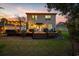 Exterior shot of a home featuring a wooden deck and well-manicured lawn at 3255 Gervais Ln., Myrtle Beach, SC 29588