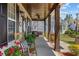Spacious porch with wood columns, swing, and potted plants at 3255 Gervais Ln., Myrtle Beach, SC 29588