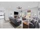Inviting living room features a ceiling fan, fireplace, and dark wood-look floors at 3255 Gervais Ln., Myrtle Beach, SC 29588