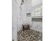 Modern shower with white marble and pebble tile, and built-in niches at 3255 Gervais Ln., Myrtle Beach, SC 29588