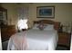 Comfortable bedroom with a wooden bed frame, dresser, and soft natural light at 3904 Birchwood St., North Myrtle Beach, SC 29582