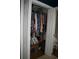 Walk-in closet with clothing hanging on a rack and some items on the floor at 3904 Birchwood St., North Myrtle Beach, SC 29582