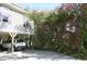 Elevated home with a covered parking area and lush landscaping at 3904 Birchwood St., North Myrtle Beach, SC 29582