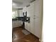 Bright kitchen with white cabinetry, stainless steel appliances, and hardwood floors at 3904 Birchwood St., North Myrtle Beach, SC 29582