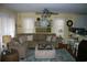 Comfortable living room with large sectional sofa, ceiling fan, and decorative accents at 3904 Birchwood St., North Myrtle Beach, SC 29582