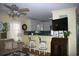 Stylish living room showcasing seating, large TV, and a view into the kitchen at 3904 Birchwood St., North Myrtle Beach, SC 29582
