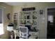 Well-lit home office with a window, desk, and shelving for organization at 3904 Birchwood St., North Myrtle Beach, SC 29582