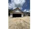 New construction home featuring a two-car garage and architectural details at 4028 Copperhead Rd., Conway, SC 29527