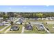 Wide aerial shot showcasing a residential area with a picturesque pond and well-maintained homes at 441 Garden Ave., Georgetown, SC 29440