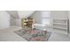 Finished attic with a play area, a colorful rug, and natural light from the windows at 441 Garden Ave., Georgetown, SC 29440