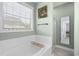 Relaxing bathroom with a soaking tub, a walk-in shower, and calming natural light at 441 Garden Ave., Georgetown, SC 29440