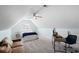 Cozy bedroom features a ceiling fan, a comfortable bed, a desk, and ample natural light at 441 Garden Ave., Georgetown, SC 29440