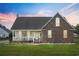 Beautiful home exterior featuring brick and siding with a cozy front porch at sunset at 441 Garden Ave., Georgetown, SC 29440
