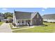 Charming brick and siding home with a welcoming front porch and beautifully landscaped front yard at 441 Garden Ave., Georgetown, SC 29440