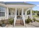Charming front porch with white railing, brick steps, and inviting decor at 441 Garden Ave., Georgetown, SC 29440