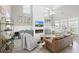 Airy living room with modern fireplace, shiplap accent wall, comfortable seating and bright windows at 441 Garden Ave., Georgetown, SC 29440