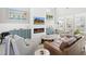 Cozy living room featuring a sleek fireplace, shiplap accent wall, and stylish furniture for comfortable living at 441 Garden Ave., Georgetown, SC 29440