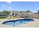 Spacious backyard with an in-ground pool, lounge chairs, and a trampoline provides outdoor recreation at 441 Garden Ave., Georgetown, SC 29440