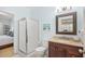 Bright bathroom features a walk-in shower, framed mirror, vanity with storage and granite countertops at 601 Hillside Dr. N # 2305, North Myrtle Beach, SC 29582