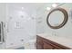 Beautiful bathroom showcasing a walk-in shower with white subway tile, a dark vanity, and brushed nickel fixtures at 601 Hillside Dr. N # 2305, North Myrtle Beach, SC 29582