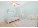 Comfortable bedroom with twin beds, light blue walls, shuttered windows, and nautical decorative elements at 601 Hillside Dr. N # 2305, North Myrtle Beach, SC 29582