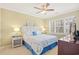 Charming bedroom with a queen bed, shuttered windows, neutral walls, and coordinating bedside lamps at 601 Hillside Dr. N # 2305, North Myrtle Beach, SC 29582