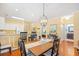 Dining area with wood table and view into kitchen and bedroom at 601 Hillside Dr. N # 2305, North Myrtle Beach, SC 29582