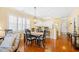 Open dining area adjacent to kitchen features a wood table and decorative lighting at 601 Hillside Dr. N # 2305, North Myrtle Beach, SC 29582