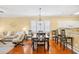 Dining area features modern chandelier, wood table, and stylish chairs at 601 Hillside Dr. N # 2305, North Myrtle Beach, SC 29582