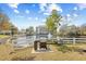 Community grilling area overlooking a pond with a fountain feature and seating, perfect for outdoor entertaining at 601 Hillside Dr. N # 2305, North Myrtle Beach, SC 29582