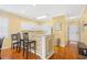 Cozy kitchen features white cabinets, breakfast bar, and hardwood floors at 601 Hillside Dr. N # 2305, North Myrtle Beach, SC 29582