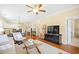 Open living area showcasing hardwood floors, a ceiling fan, and seamless access to the kitchen and dining area at 601 Hillside Dr. N # 2305, North Myrtle Beach, SC 29582