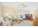 Comfortable living room with plush seating, ceiling fan, and open floor plan at 601 Hillside Dr. N # 2305, North Myrtle Beach, SC 29582