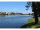 Scenic waterfront view of a pond surrounded by trees and green grass, ideal for a peaceful community setting at 601 Hillside Dr. N # 2305, North Myrtle Beach, SC 29582