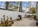 Spacious backyard includes a grill and umbrella-covered table and chairs, ideal for outdoor entertaining at 613 Cypress Dr., Surfside Beach, SC 29575