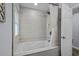 Inviting bathroom featuring a shower with decorative tile surround and plenty of space at 613 Cypress Dr., Surfside Beach, SC 29575