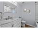 Updated bathroom with marble vanity, framed mirror, and modern fixtures at 613 Cypress Dr., Surfside Beach, SC 29575