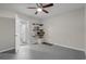 Neutral bedroom includes shelving and direct access to the bathroom, ensuring practical organization and functionality at 613 Cypress Dr., Surfside Beach, SC 29575