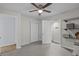Neutral bedroom features a ceiling fan, closet, and access to the bathroom, offering comfort and convenience at 613 Cypress Dr., Surfside Beach, SC 29575